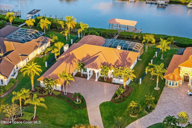 birds eye view of property with a water view