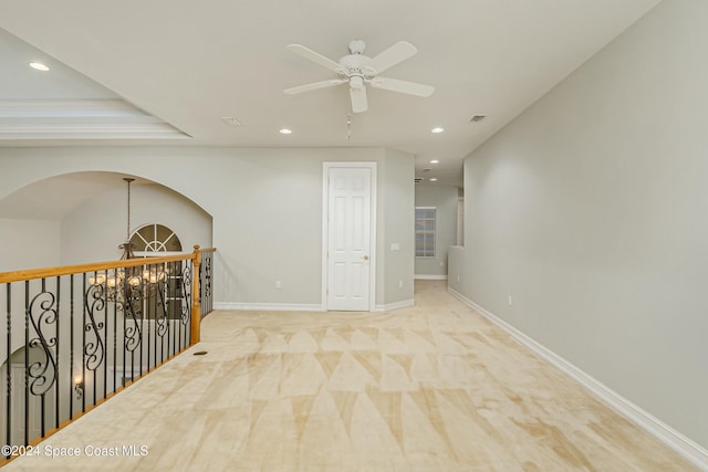 corridor with light colored carpet