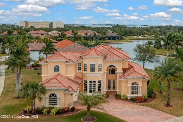 view of front of property featuring a water view and french doors