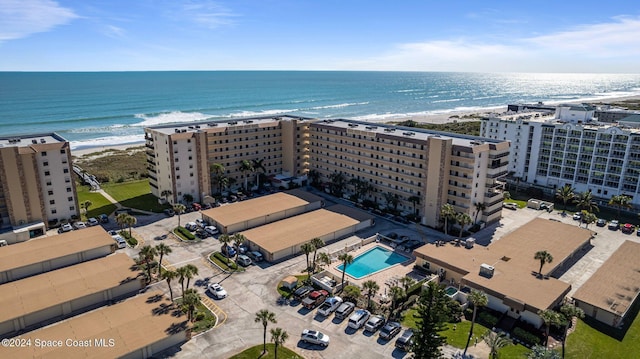 bird's eye view featuring a view of the beach and a water view