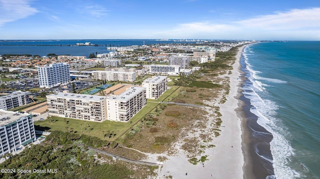 bird's eye view with a water view, a city view, and a view of the beach