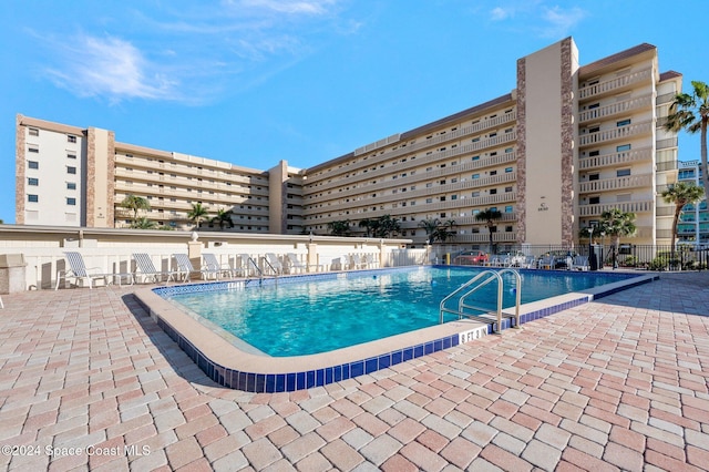 view of pool featuring a patio area