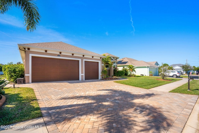 mediterranean / spanish home featuring a front lawn