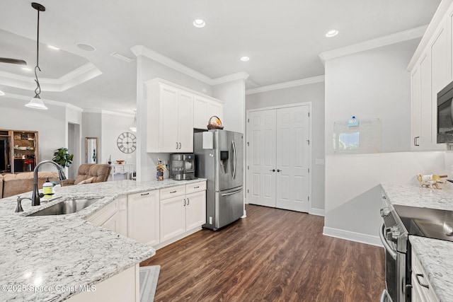 kitchen featuring pendant lighting, white cabinets, sink, dark hardwood / wood-style flooring, and stainless steel appliances