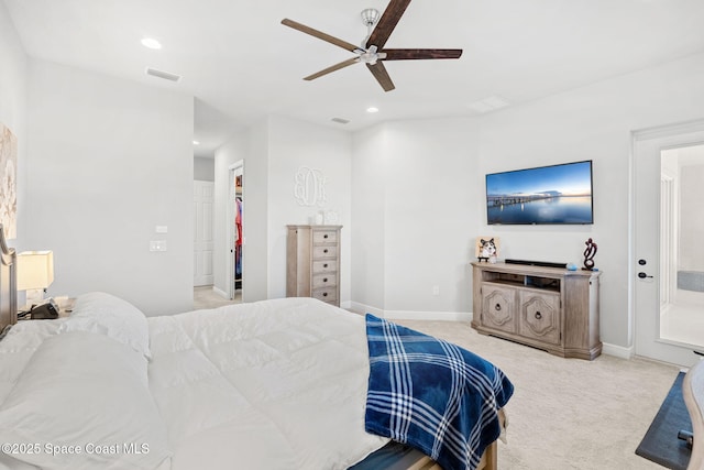 bedroom featuring light carpet and ceiling fan