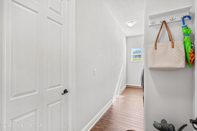 hallway featuring a textured ceiling