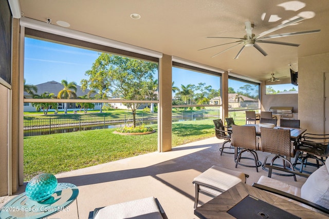 view of patio featuring area for grilling and ceiling fan