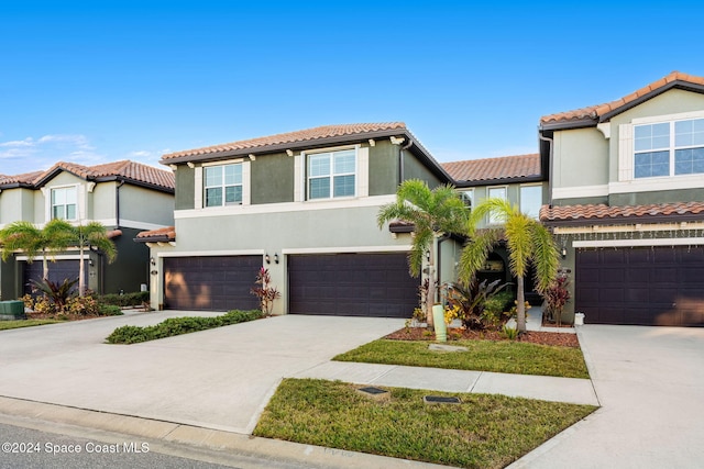 mediterranean / spanish-style house featuring a garage