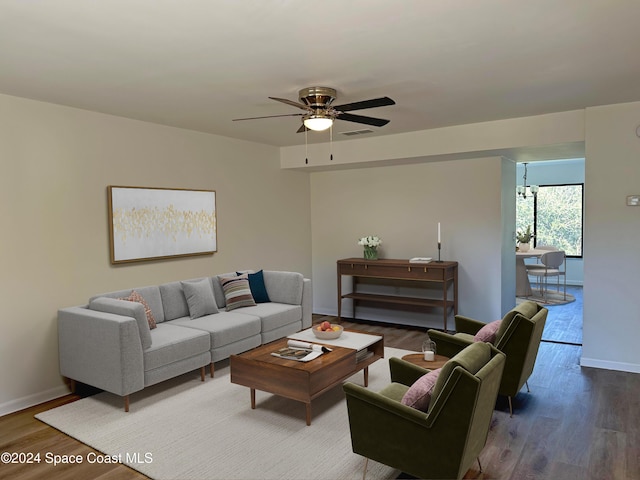 living room featuring hardwood / wood-style floors and ceiling fan