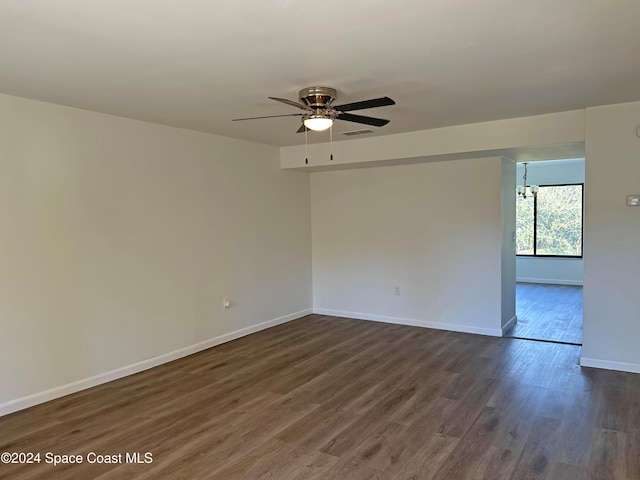 unfurnished room featuring dark hardwood / wood-style floors and ceiling fan