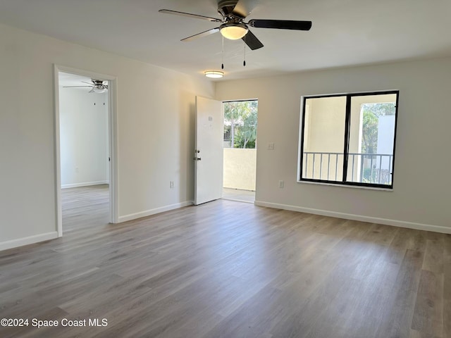 200 International Dr Unit 309, Cape Canaveral, FL 32920 - unfurnished room with a ceiling fan, healthy amount of natural light, and wood finished floors