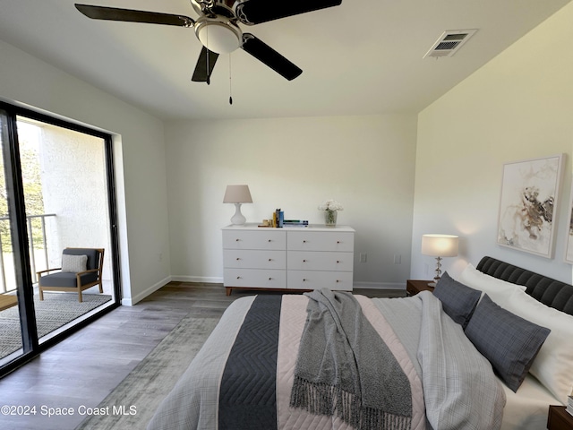 200 International Dr Unit 309, Cape Canaveral, FL 32920 - bedroom with wood finished floors, access to exterior, and a ceiling fan