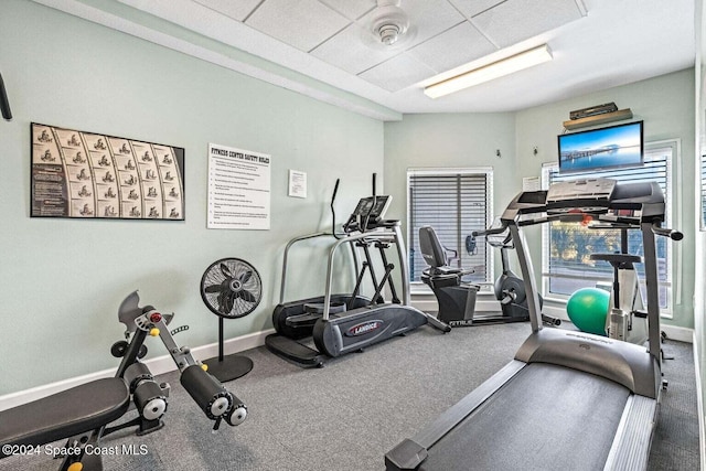 workout area with a paneled ceiling