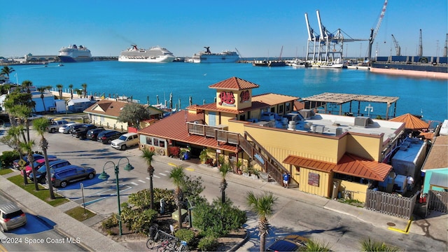 birds eye view of property with a water view