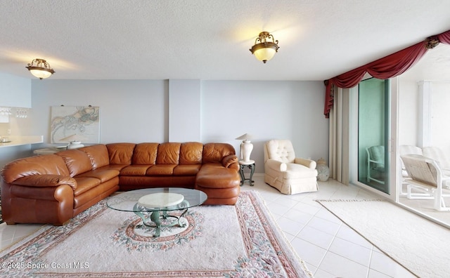 tiled living room with a textured ceiling and a healthy amount of sunlight