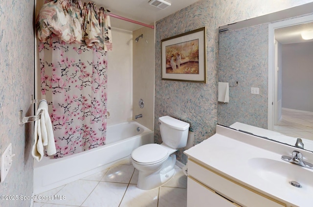 full bathroom featuring toilet, vanity, tile patterned floors, and shower / tub combo with curtain