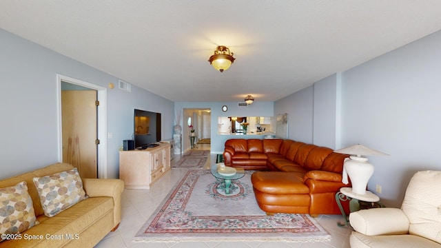 living room with light tile patterned flooring