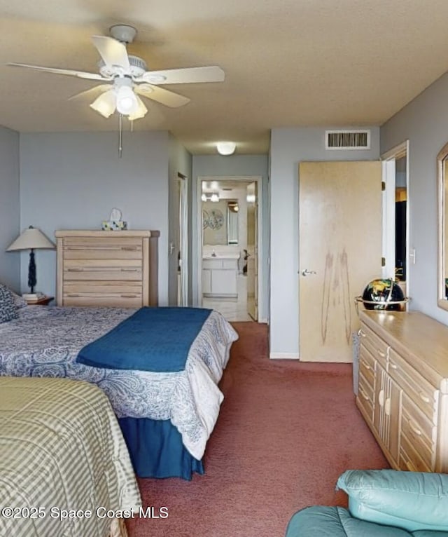 carpeted bedroom featuring connected bathroom and ceiling fan