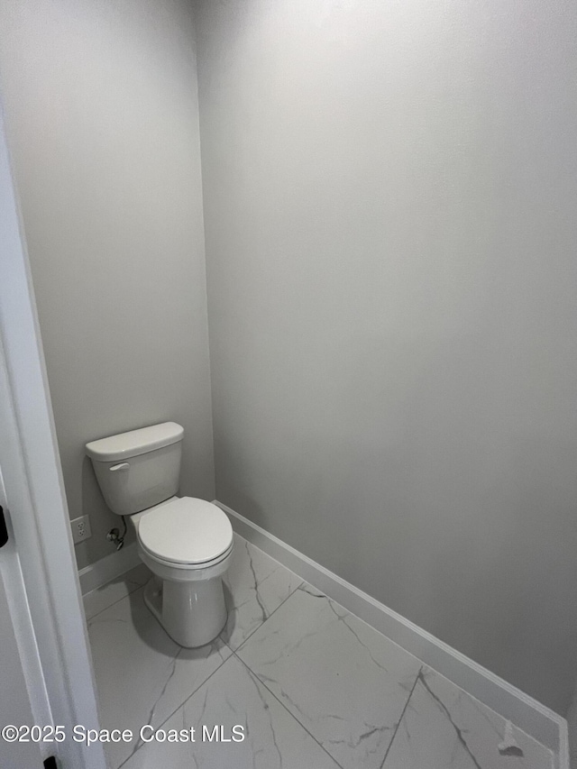 bathroom featuring toilet