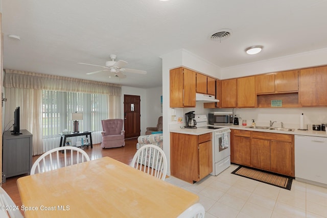 kitchen with ceiling fan, white appliances, and sink