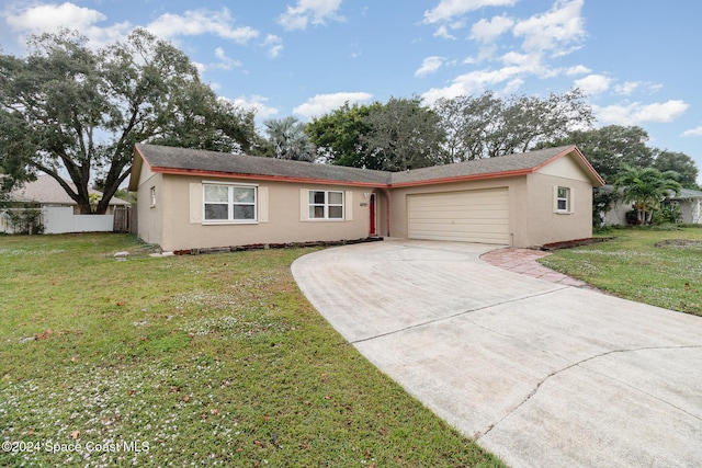 single story home with a front lawn and a garage