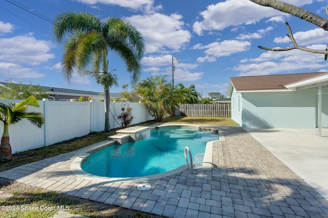 view of swimming pool with a patio