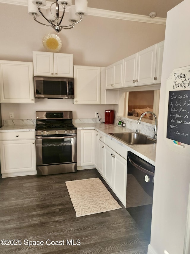 kitchen featuring crown molding, white cabinetry, sink, and appliances with stainless steel finishes