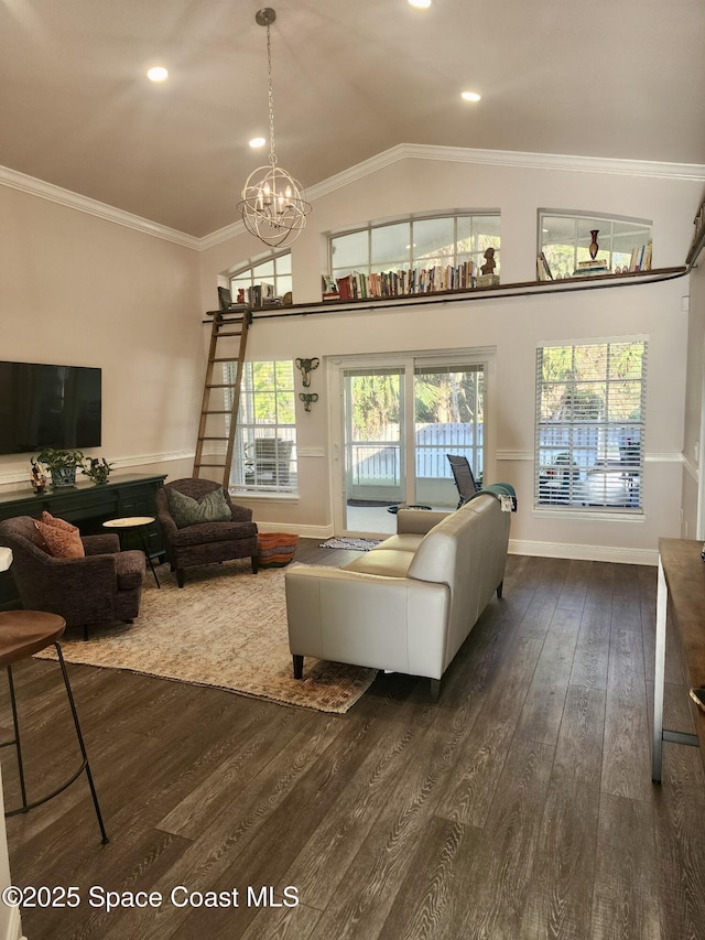 living room featuring crown molding, vaulted ceiling, dark wood-type flooring, and a notable chandelier