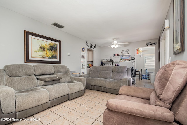 tiled living room featuring ceiling fan