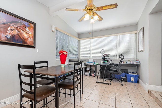 tiled dining room featuring ceiling fan and vaulted ceiling