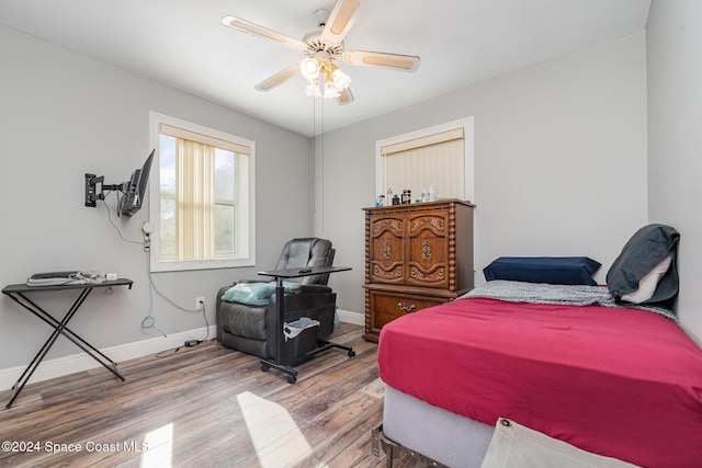 bedroom with ceiling fan and hardwood / wood-style floors