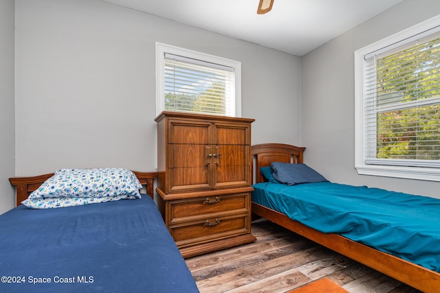 bedroom with hardwood / wood-style floors and ceiling fan