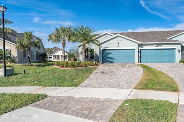 single story home featuring a front yard and a garage