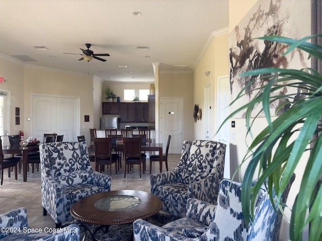 living room with ceiling fan, crown molding, and light tile patterned flooring