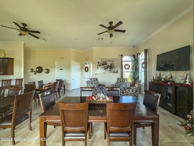 tiled dining room with crown molding and ceiling fan