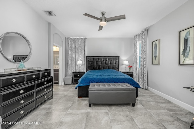 bedroom with connected bathroom and ceiling fan