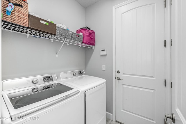 laundry room with washer and clothes dryer