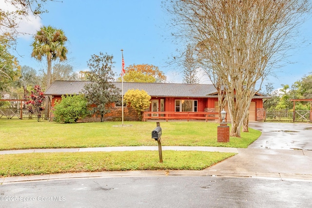 single story home with a front yard