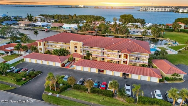 aerial view at dusk with a water view