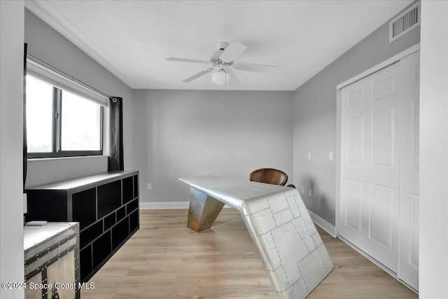 home office featuring ceiling fan and light wood-type flooring