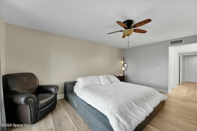 bedroom featuring ceiling fan and light hardwood / wood-style flooring