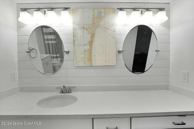 bathroom with vanity and toilet