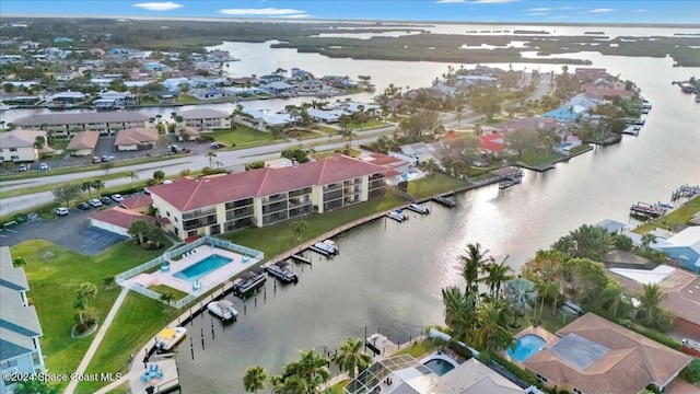 drone / aerial view with a water view