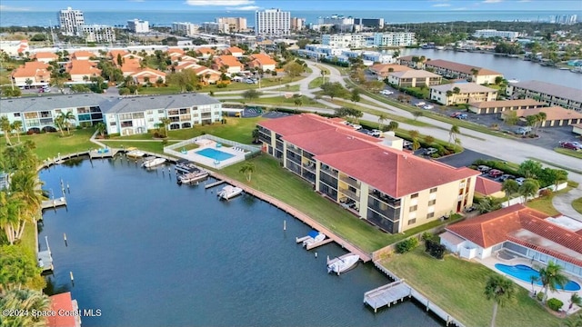 birds eye view of property with a water view