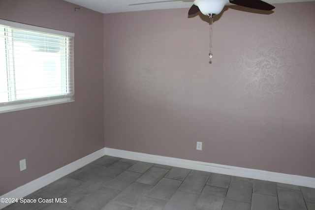 empty room featuring ceiling fan