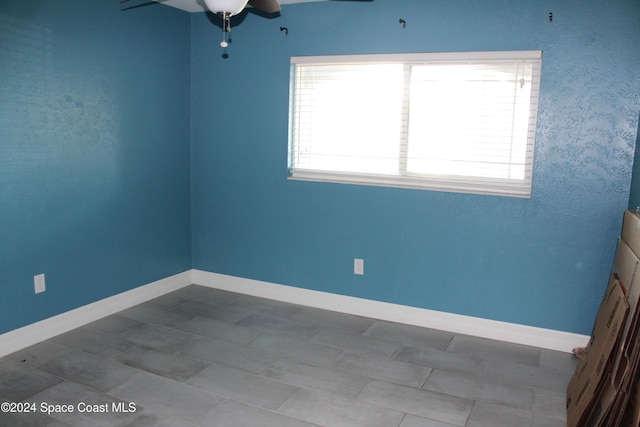 unfurnished room with ceiling fan