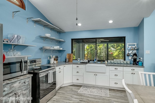 kitchen featuring white cabinetry, light hardwood / wood-style flooring, stainless steel appliances, and sink