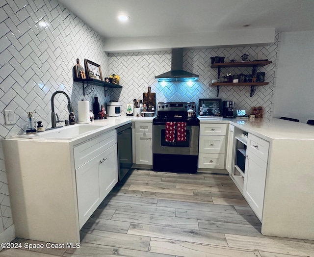 kitchen with tasteful backsplash, wall chimney exhaust hood, stainless steel electric stove, black dishwasher, and white cabinetry