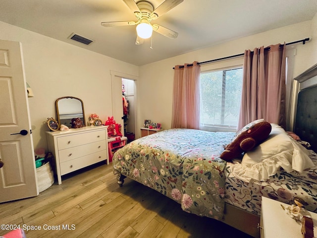 bedroom featuring ceiling fan and light hardwood / wood-style flooring