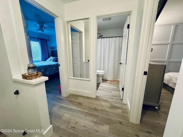 hallway with light hardwood / wood-style flooring